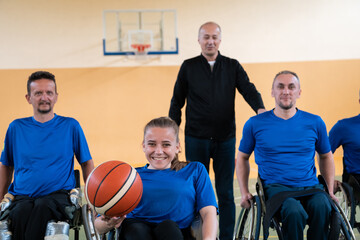 photo of the basketball team of war invalids with professional sports equipment for people with disabilities on the basketball court