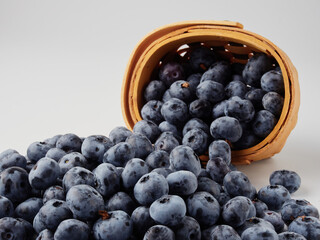 Blueberry fruit top view isolated on a white background, flat lay overhead layout with mint leaf, healthy design concept.