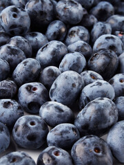 Blueberry fruit top view isolated on a white background, flat lay overhead layout with mint leaf, healthy design concept.