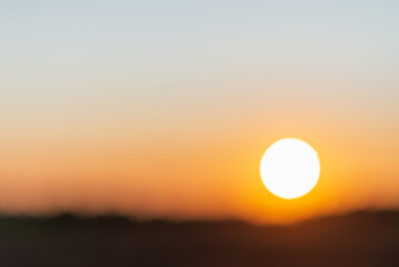 Blurred sunset landscape.Summer holiday concept. blurry beautiful sunlight and golden sunset background.