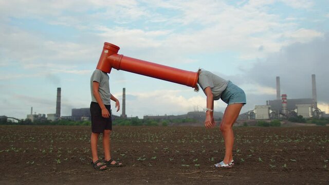 Pipe people. Mother and son outdoors concept family, slow motion video. Little boy holding mom's hands. Mom hugs takes care of her son little boy at lifestyle sunset teamwork.
