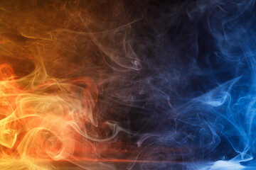 Obraz premium Art photo of colorful smoke moves on black background. Beautiful swirling colorful smoke.