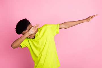 Photo of young african guy cover eyes dance performer dab pose hip-hope isolated over pink color...