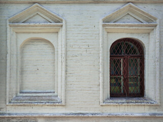 Fototapeta na wymiar Stone platband ,wooden window,lattice