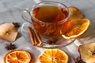 Cup of tea and slices of dried orange
