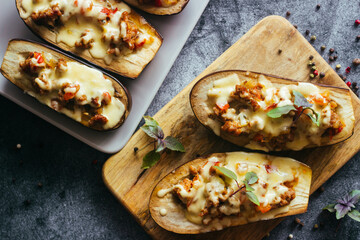 Stuffed eggplant. Delicious hot dish. Eggplant with meat, cheese and herbs