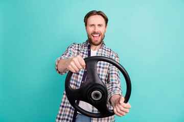 Photo of young man happy positive smile excited enjoy ride car fast speed steering-wheel isolated over teal color background