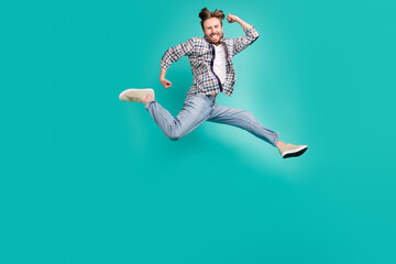 Full length body size photo man jumping up running isolated pastel turquoise color background