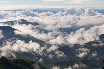 Sea of fog flow over mountain on the morning.