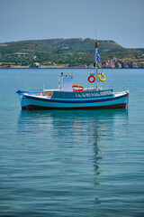 Naklejka na ściany i meble Greek fishing boat in Aegean sea near Milos island, Greece