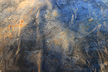 spilled gasoline rainbow background, industrial hazard spill pollution, abstract texture multicolored