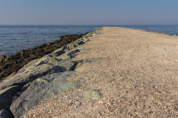 A pebble road in the middle of a rocky seashore