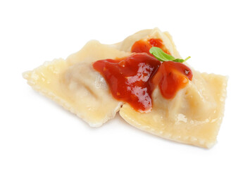Tasty ravioli with tomato sauce on white background