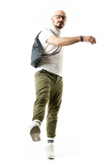 Cool nerdy style hipster male geek with glasses kicking leg towards camera. Full length portrait...