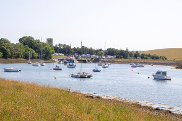 Fototapeta na wymiar Pleasure boats moored in the calm waters at the National Trust property at Gibbs Island