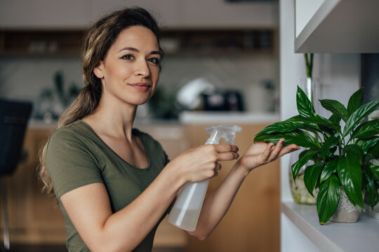 Young Woman, Taking Care Of Her Plants.