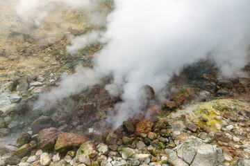 Exciting view of volcanic landscape, erupting fumarole, aggressive hot spring, gas-steam activity...