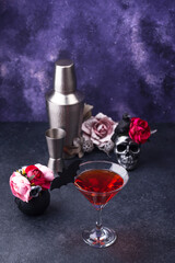 Halloween martini cocktail on purple background