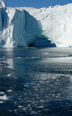 Fototapeta na wymiar a cave in the icebergs on the sea, Ilulissat Icefjord, Illulissat, Greenland