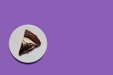 Creative concept health diet sweet food photo of pastry  chocolate cake on purple background.