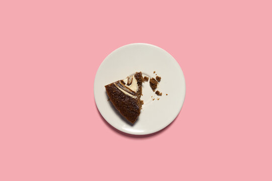 Creative concept health diet sweet food photo of pastry  chocolate cake on pink background.