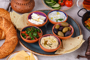 Traditional Turkish breakfast with meze and simit