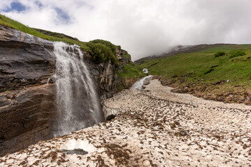 Picturesque alpine waterfall at Grossglockner high alpine road. Austria