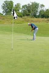 Obraz premium Golfer's putt is away on a links course.