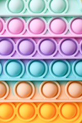 Colorful antistress sensory toy fidget push pop it , close up - obrazy, fototapety, plakaty