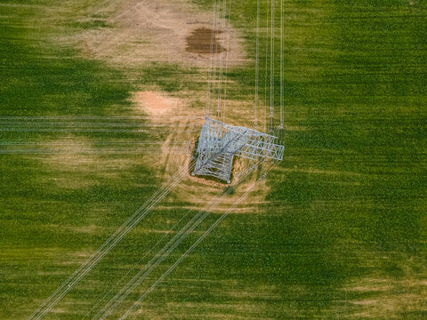 Power line metal support in nature. - Powered by Adobe