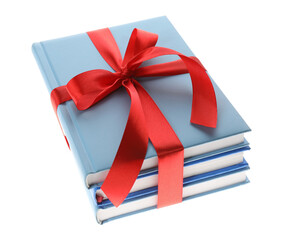 Different books tied with red ribbon isolated on white