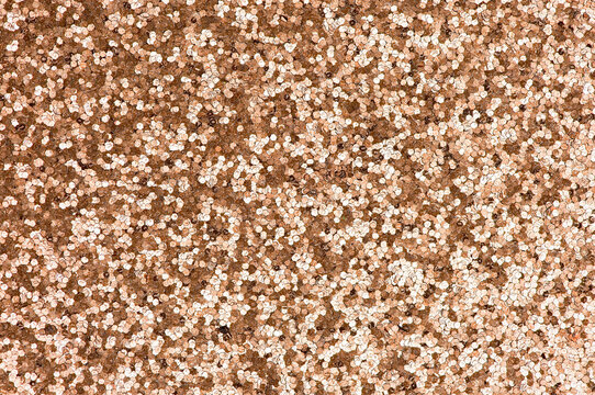 Sepia brown backdrop made with glitters. Macro shot of brown glittering background. High quality photo 