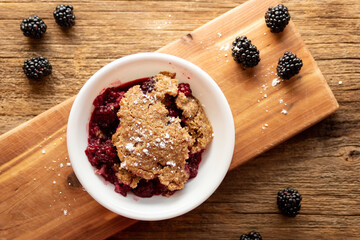 a bowl of blackberry cobbler