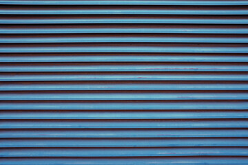 Obraz premium Old blue retro shutters with red shades