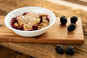 a bowl of blackberry cobbler