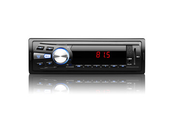 Front view of a black automobile radio with screen on with silver button on white background with reflection underneath