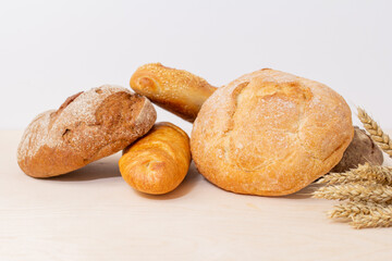 loaf of bread and wheat, assortment of bread