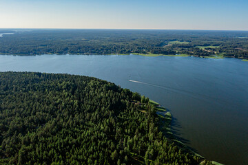 The coastline of the Gulf of Finland. There is a dense forest on the shore. Scandinavian nature, Finland. Photo from the drone.