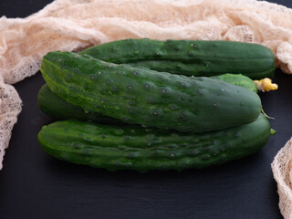 Four ripe green organic cucumbers