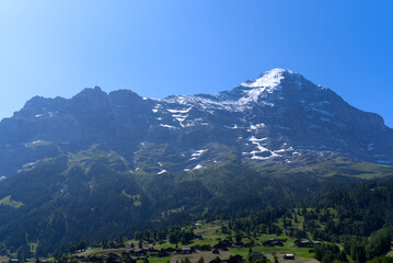 Mount Eiger on a sunny summer day seen from cable car station Grindelwald Terminal. Photo taken July 20th, 2021, Grindelwald, Switzerland.