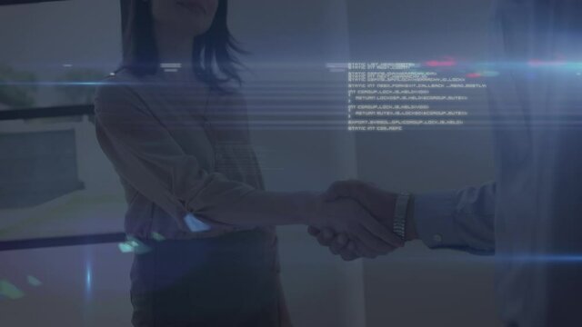 Data processing and spot of light against businessman and businesswoman shaking hands at office