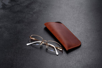 Beautiful brown case made of leather designed to store glasses