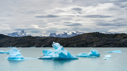 Icebergs of the Upsala glacier over Lago Argentino with the Patagonian Andes in the background
