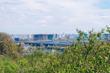 Fototapeta na wymiar Kiev, Ukraine - May 03, 2021, landscape, view of the Dnieper River and the left bank of Kiev.