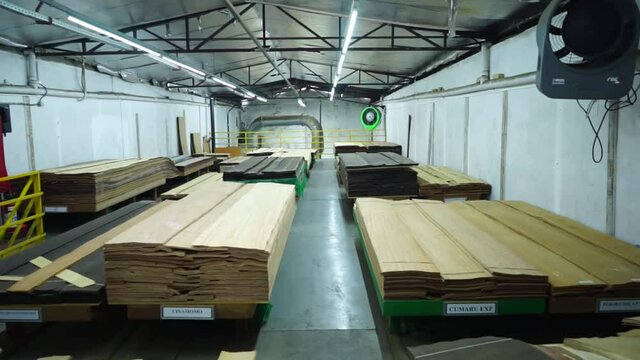 Warehouse with variety of wood for construction and repair. Wood Flooring Factory Production Line