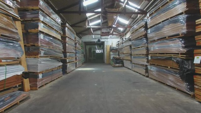 Warehouse with variety of wood for construction and repair. Wood Flooring Factory Production Line