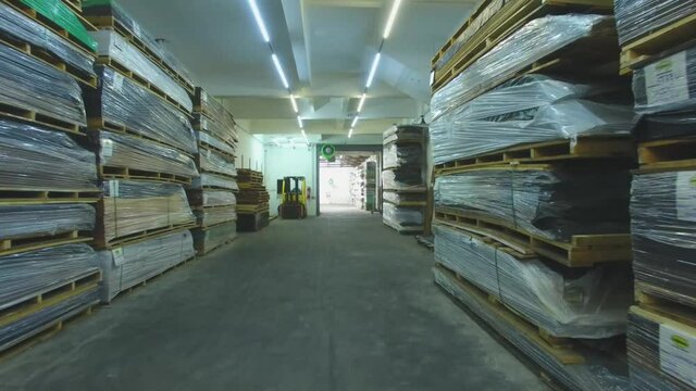 Warehouse with variety of wood for construction and repair. Wood Flooring Factory Production Line