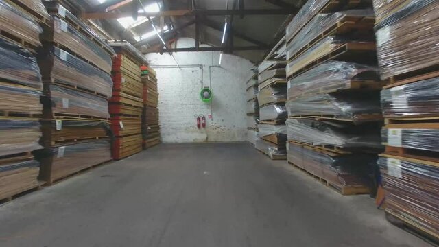 Warehouse with variety of wood for construction and repair. Wood Flooring Factory Production Line