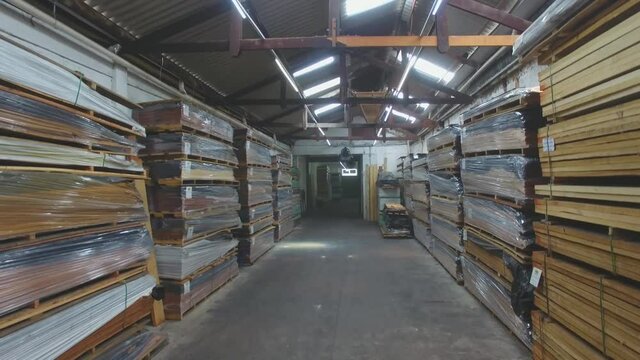 Warehouse with variety of wood for construction and repair. Wood Flooring Factory Production Line