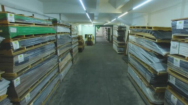 Warehouse with variety of wood for construction and repair. Wood Flooring Factory Production Line